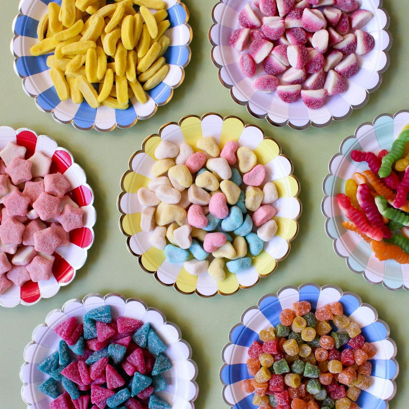 Sugar cubes stacked on a dark surface — sugar's detrimental effects on the human body